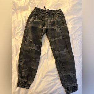 aritzia camo pants with scuched booted and waste